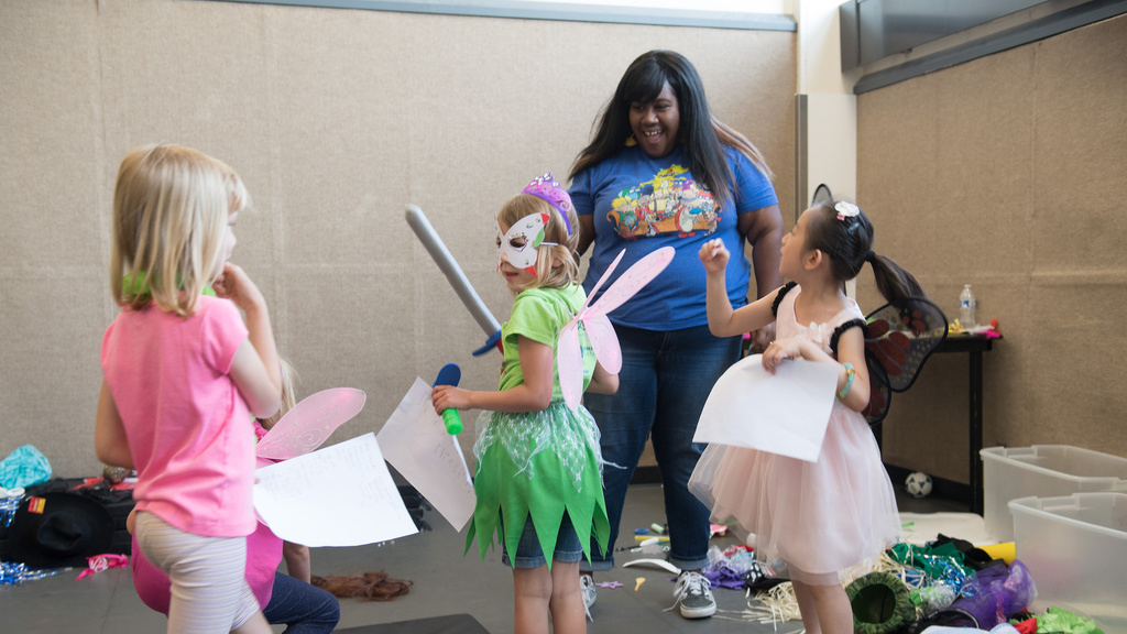 a theatre student leading a summer drama camp for area children