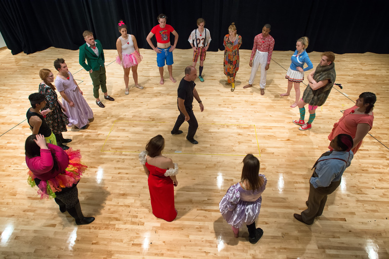 Circle of students around Prof. Paul Kalina in a clowning movement class taking place in Catalano acting studio