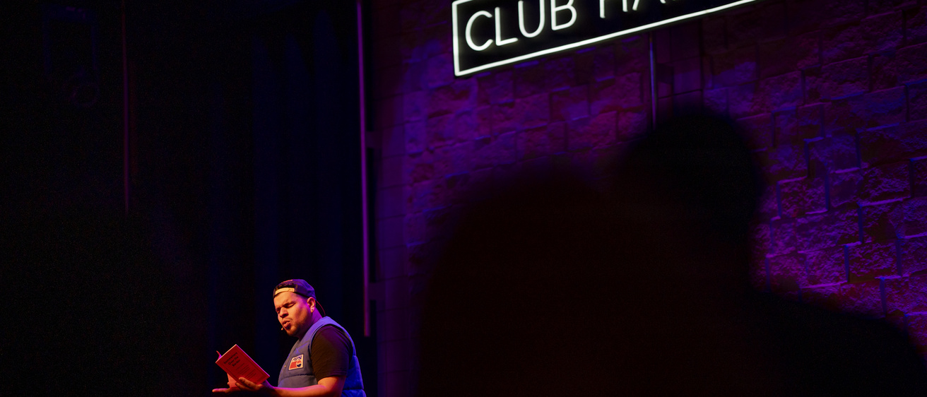 Brian Quijada on stage at Club Hancher