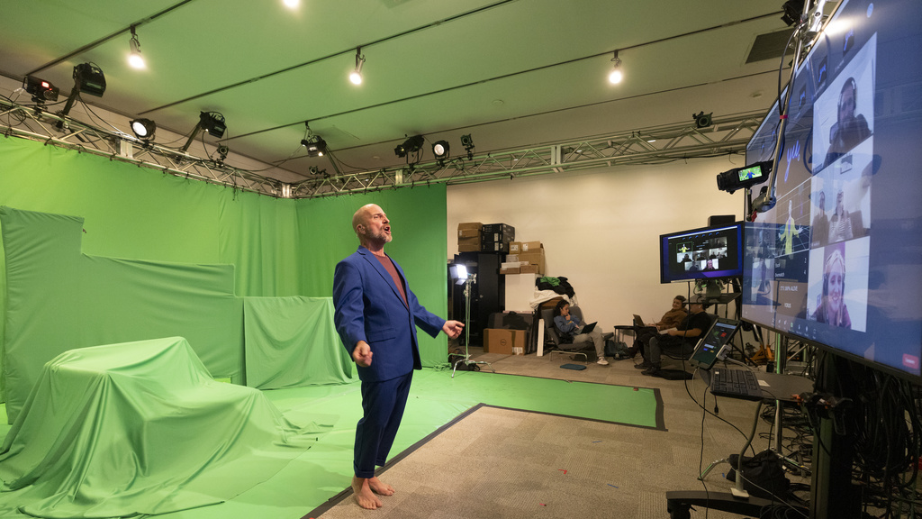 Acting faculty member Paul Kalina performing in front of a green screen set in the motion capture studio