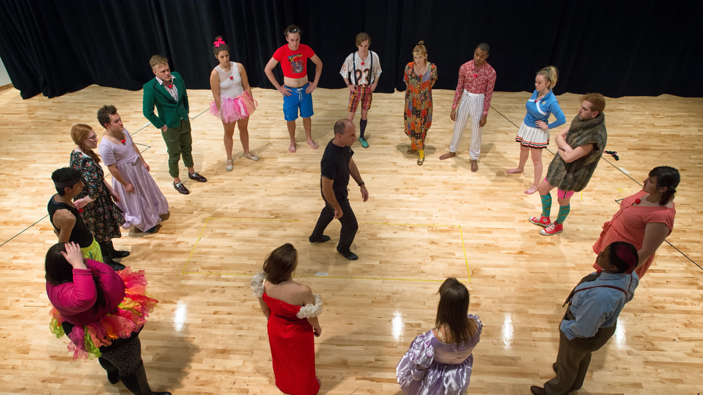 Circle of students around Prof. Paul Kalina in a clowning movement class taking place in Catalano acting studio