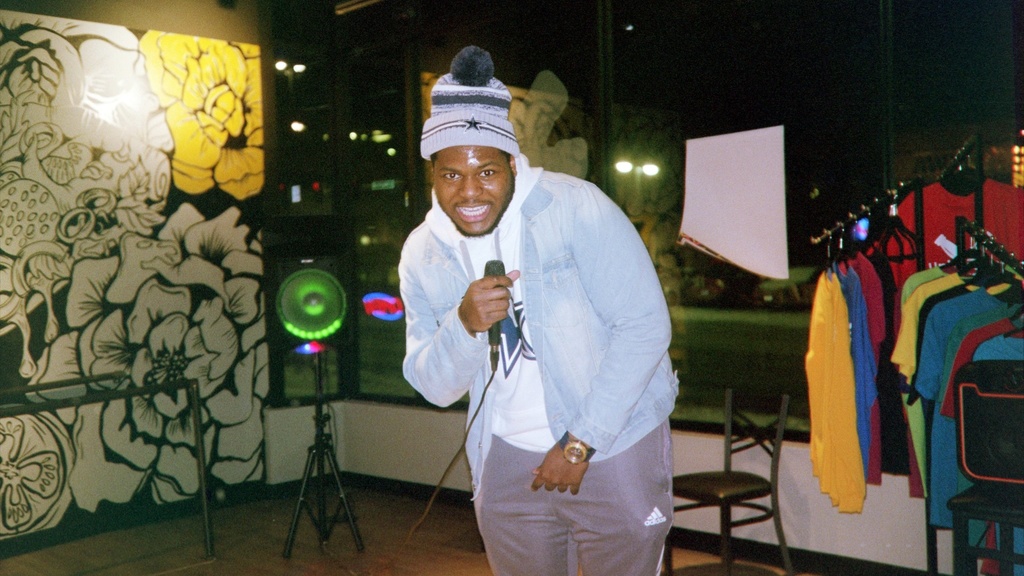 Theatre acting student performing as a rapper at a Borderless open mic event 