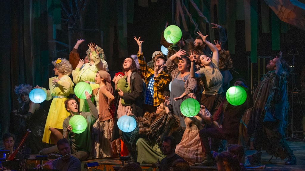 performance image of ensemble cast on stage in Into The Woods
