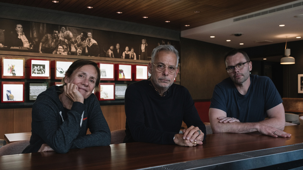 Laurie Metcalf, Joe Mantello, and Samuel D. Hunter (left to right) seated together at a bar