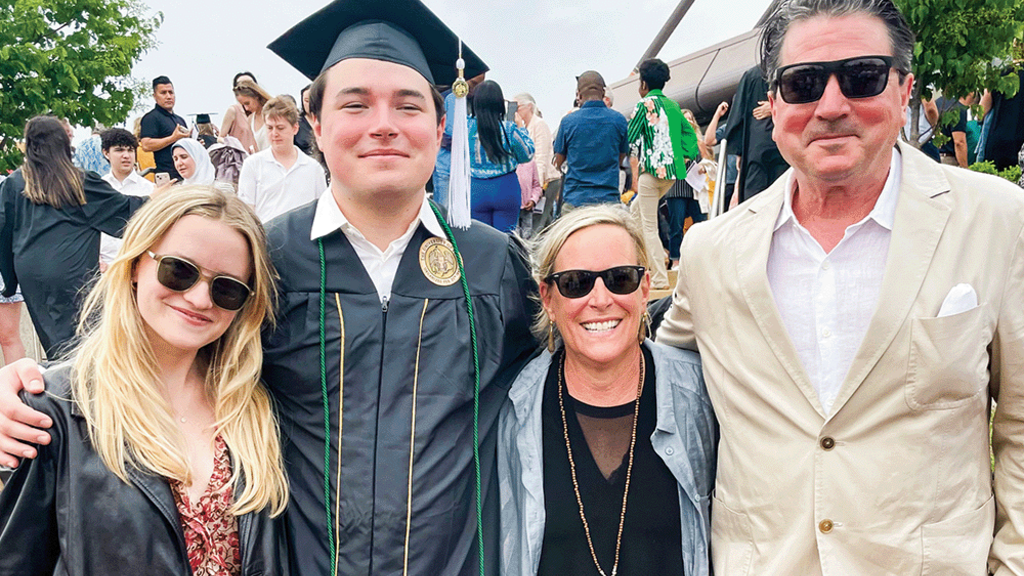 Alumni Nickolas and Penny Rhodes attend their son's graduation at the University of Iowa. 