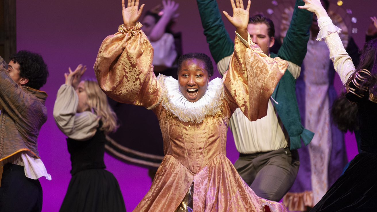 undergraduate student Virginia Muturi on the stage during a performance of Something Rotten!